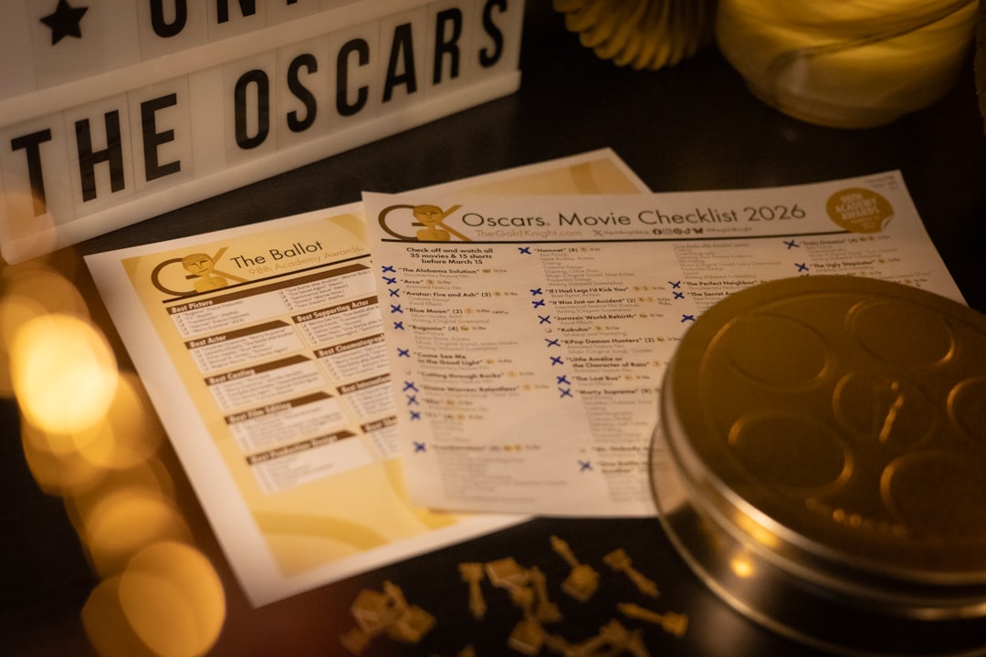 Oscars movie checklist and ballot with film reel tin.