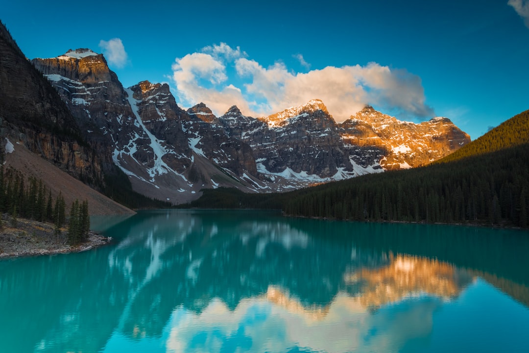 A calm lake under a wide blue sky
