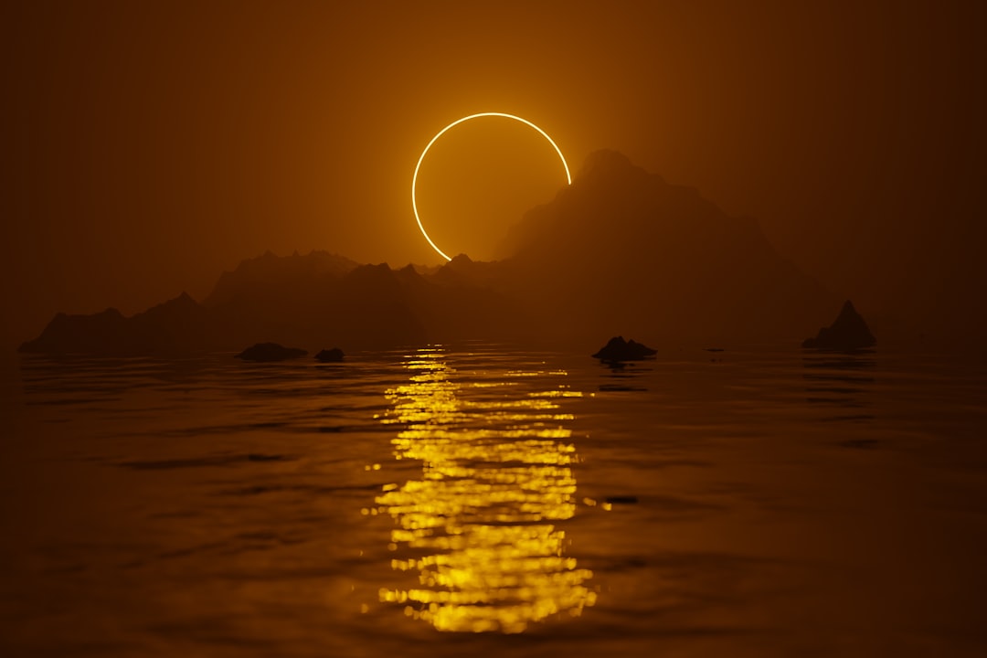 The sun setting over a body of water