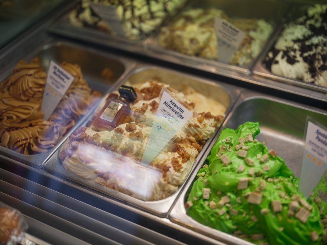 Various flavors of gelato in a display case.