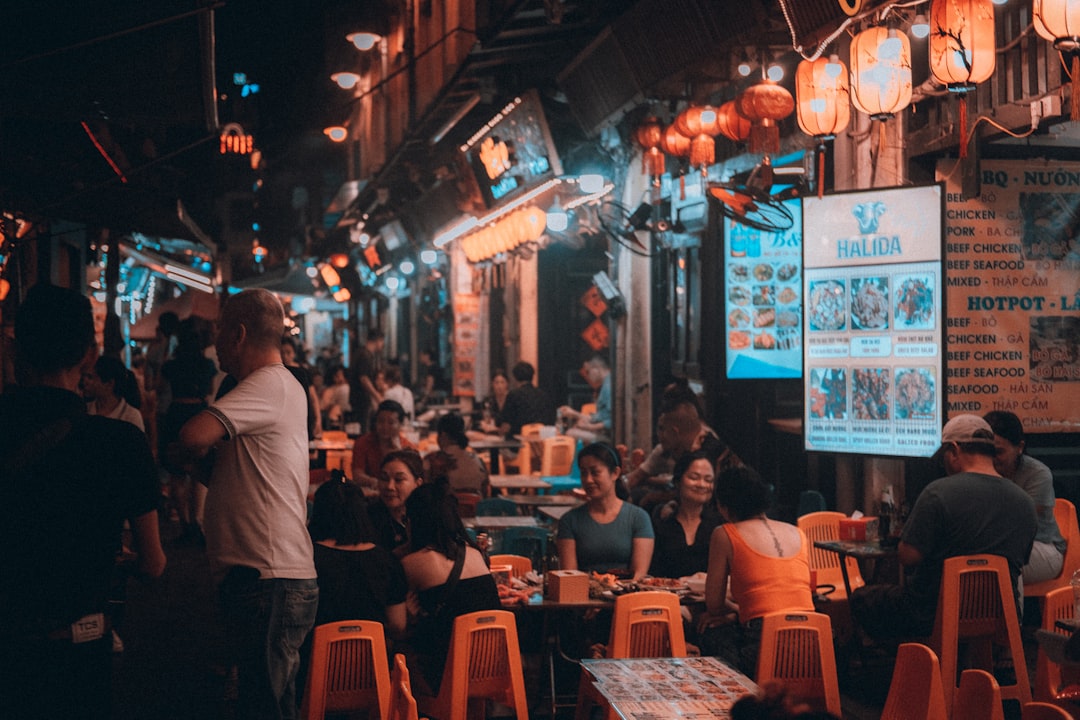 A group of people sitting at tables in a restaurant
