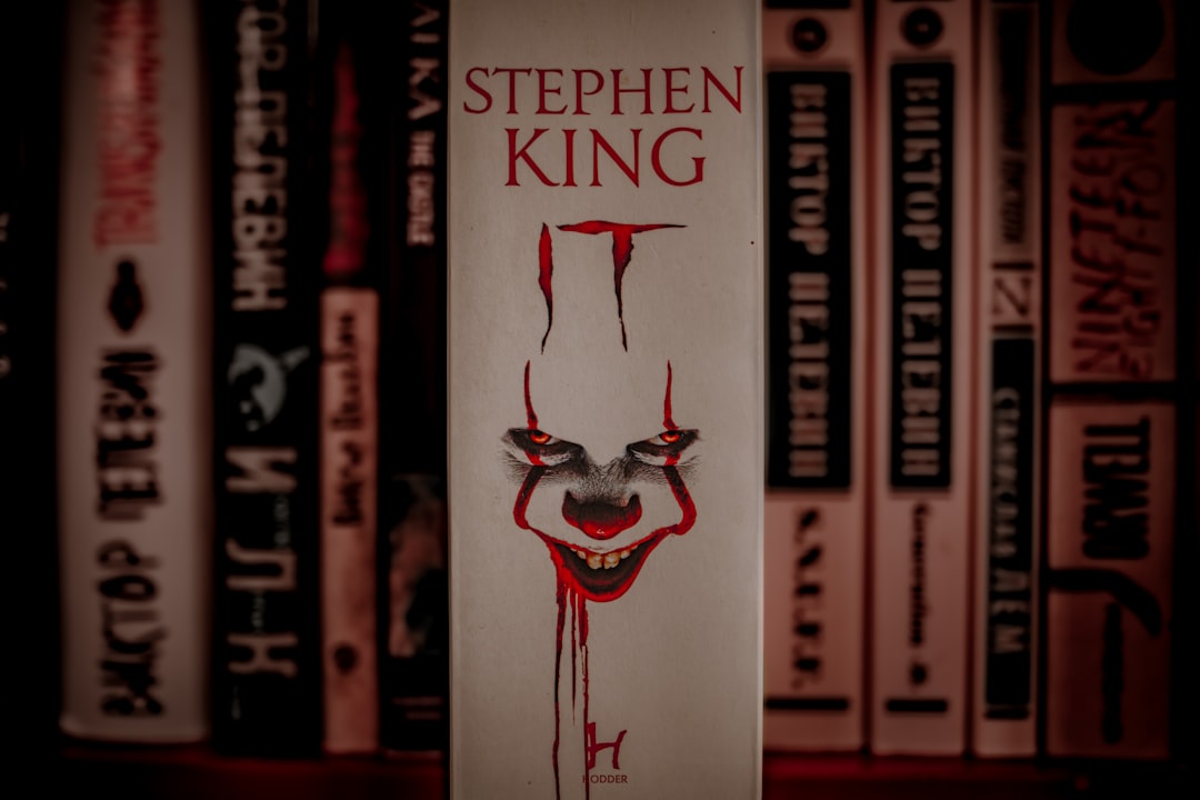 A book with a creepy clown face on it