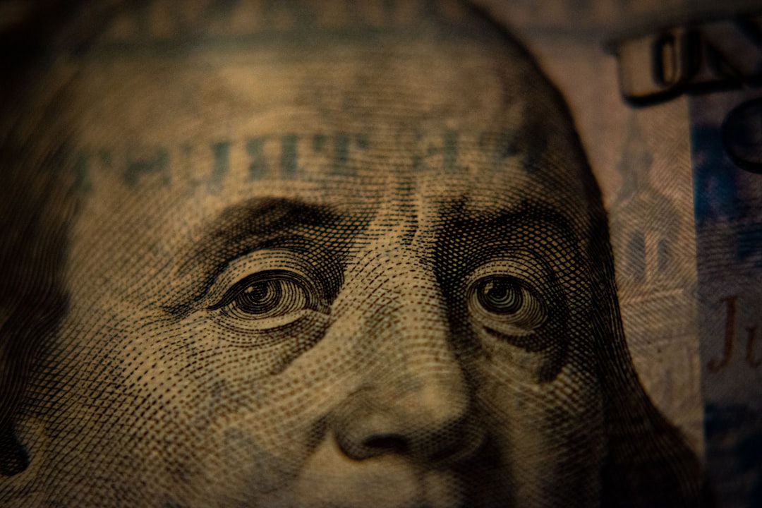A close-up of Benjamin Franklin on a United States one hundred dollar bill